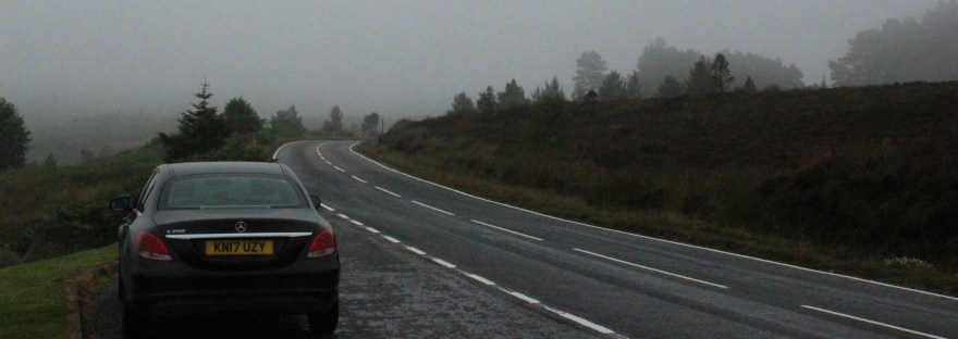 A black Mercedes in the fog