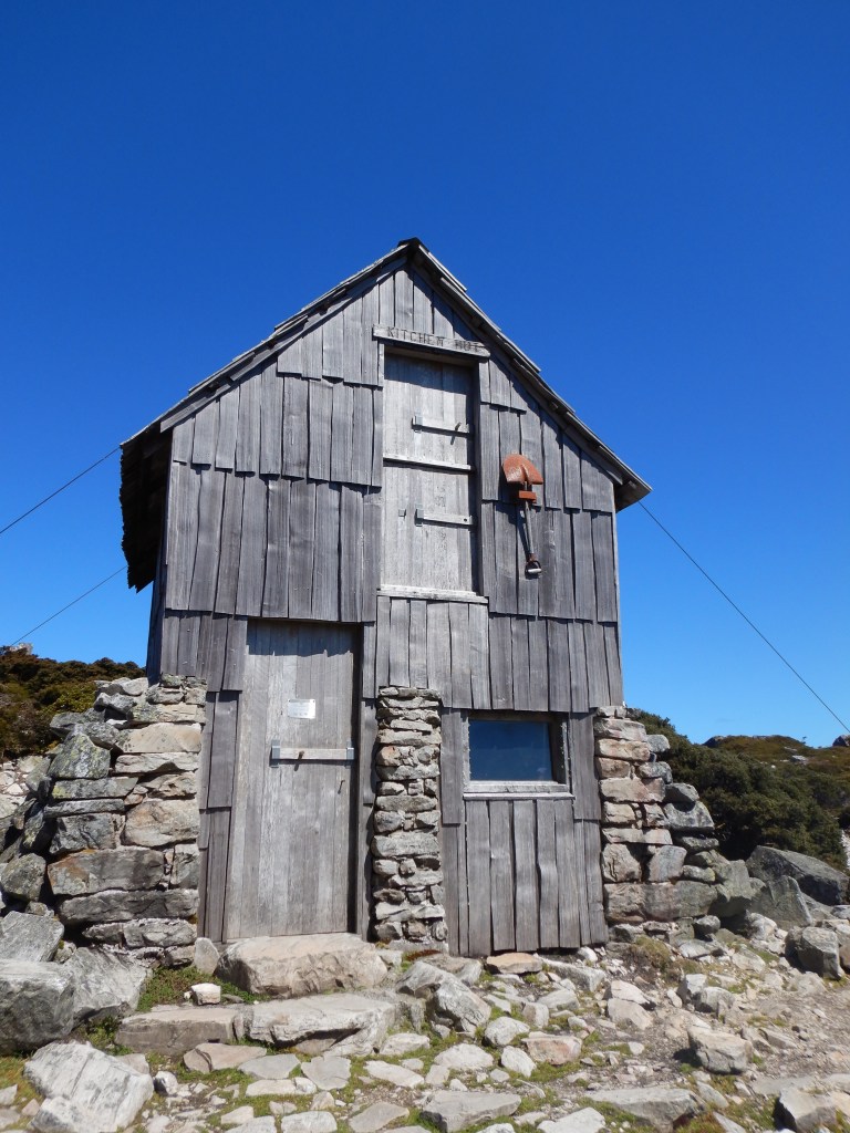 The stone and wood structure of kitchen hut provides much need shade and shelter in poor weather. 