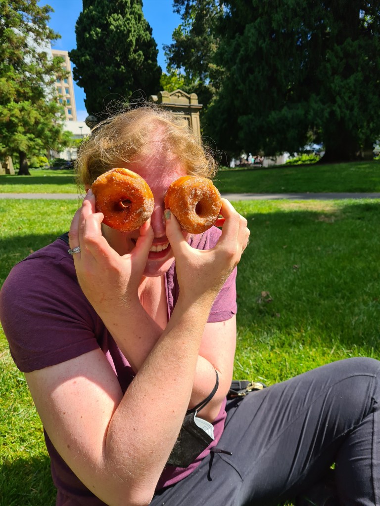 Sapphire holds a donut up to each eye like very goofy binoculars. 